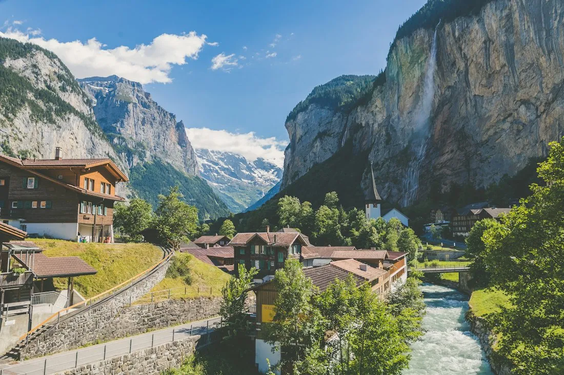A Swiss panoramic train crossing a mountain viaduct on an HCG programme