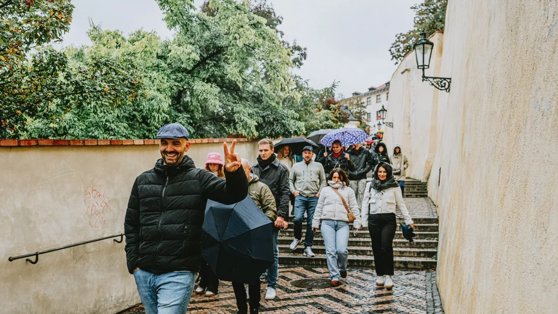 A guided group walking a cobbled lane in an Austrian old town