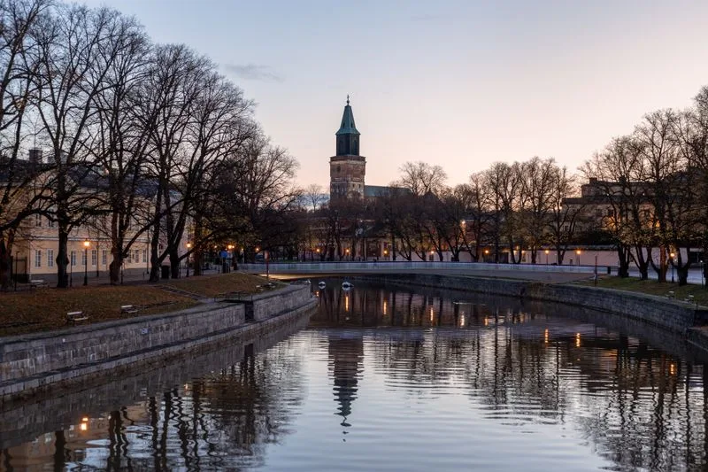 Turku Cathedral reflected in the Aura river at dusk