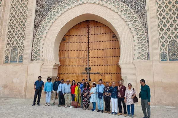 An HCG group in front of a Moorish gateway