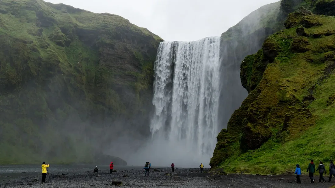 A guided group at Skógafoss waterfall on Iceland's South Coast
