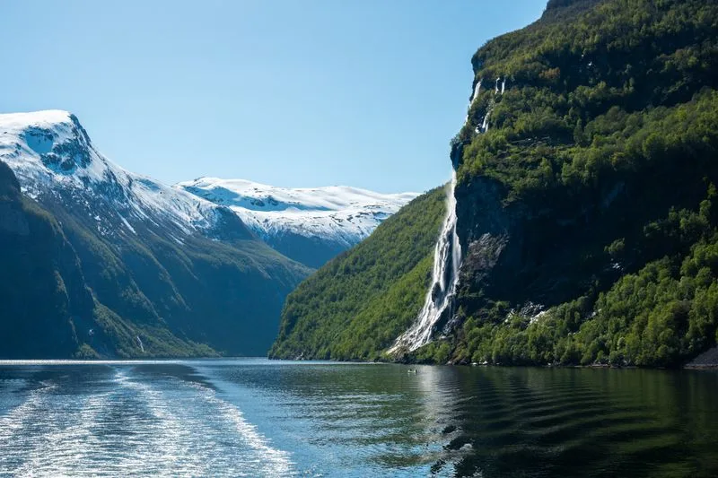 Geirangerfjord with waterfalls falling to the water