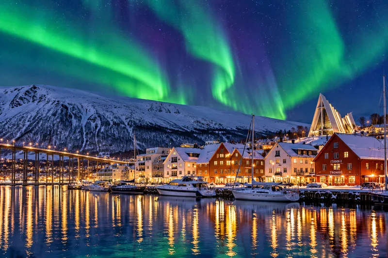 Tromso under the northern lights in winter