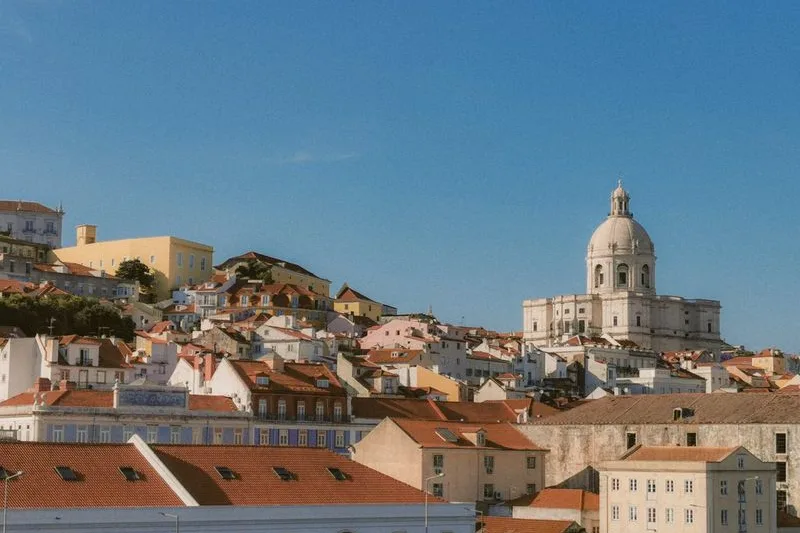 The rooftops of Alfama climbing towards the National Pantheon, Lisbon