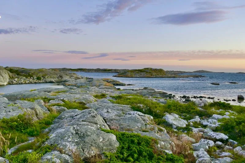 Bare granite skerries and open water in the Swedish archipelago at dusk