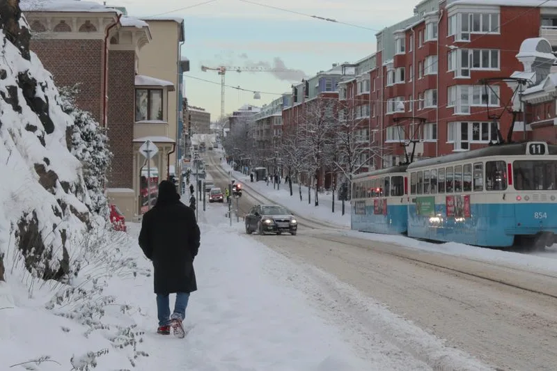 A tram on a snow-covered street in Gothenburg
